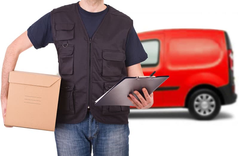 Worker With Cardboard Carton Under His Arm — Caloundra Removals & Storage in Sunshine Coast, QLD