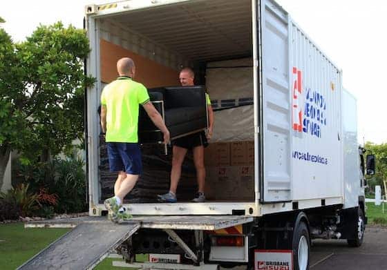 Two Removalists Loading Furniture Onto Their Truck — Caloundra Removals & Storage in Sunshine Coast, QLD