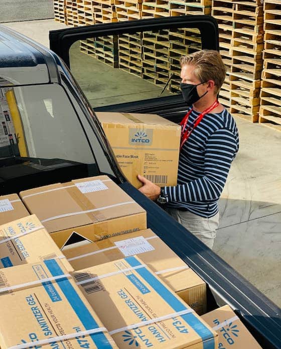 Man Loading Cardboard Boxes Into a Ute — Caloundra Removals & Storage in Sunshine Coast, QLD