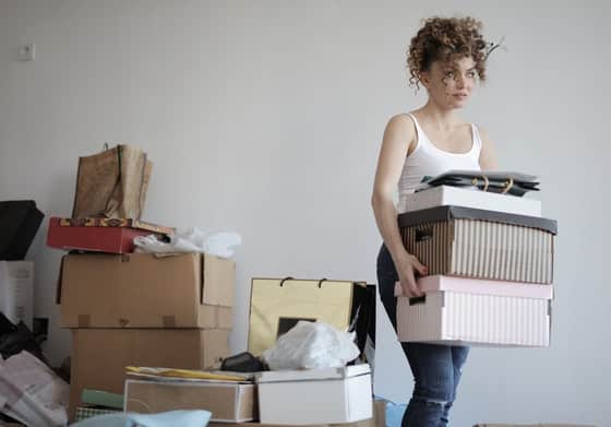Woman Carrying Boxes for Moving — Caloundra Removals & Storage in Sunshine Coast, QLD