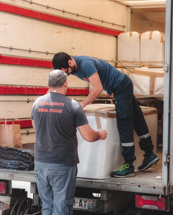 Workers Unloading a Truck — Caloundra Removals & Storage in Sunshine Coast, QLD