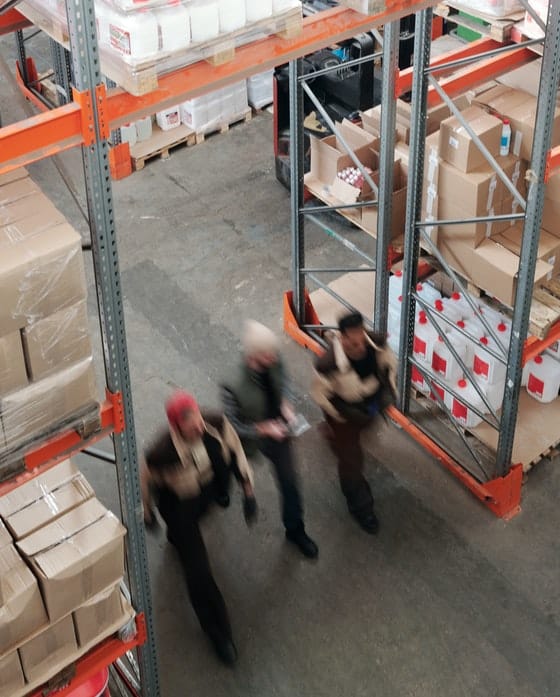 Workers Walking Through the Warehouse — Caloundra Removals & Storage in Sunshine Coast, QLD