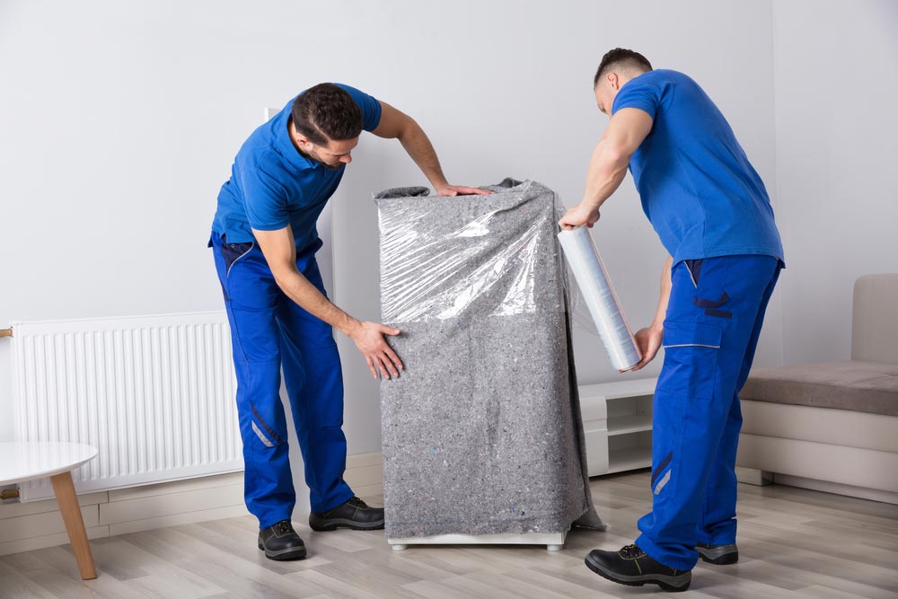 Movers Wrapping Furniture