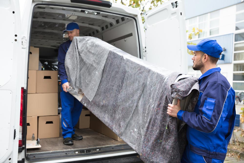 Removalist Loading A Partly Loaded Van