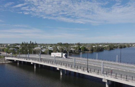 Truck Travelling Across Bridge Over River Between Townsville And Sunshine Coast In The Morning — Caloundra Removals & Storage in Sunshine Coast, QLD